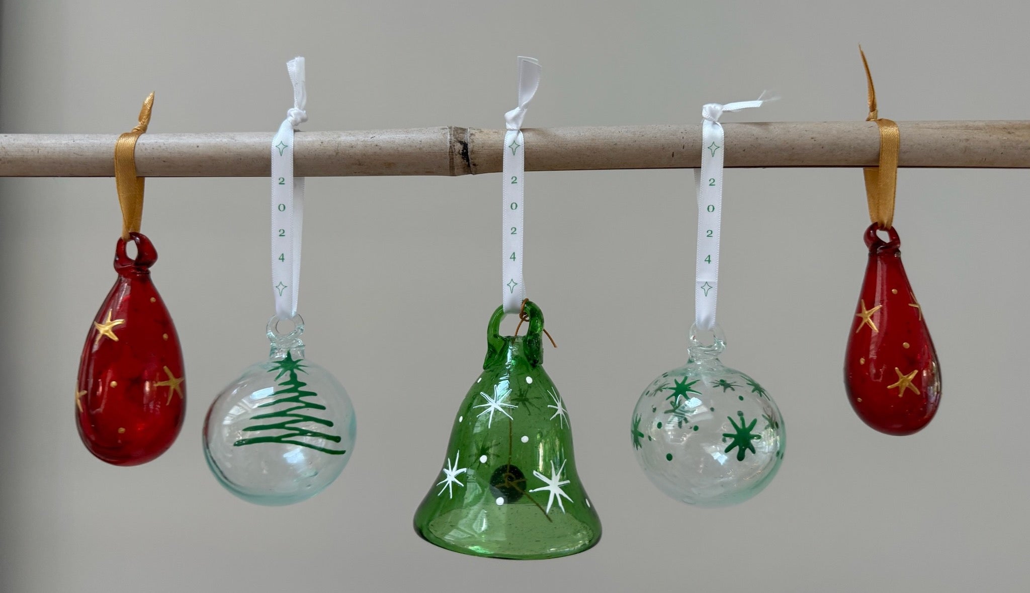 green red and clear Christmas baubles handmade from recycled glass in Bethlehem