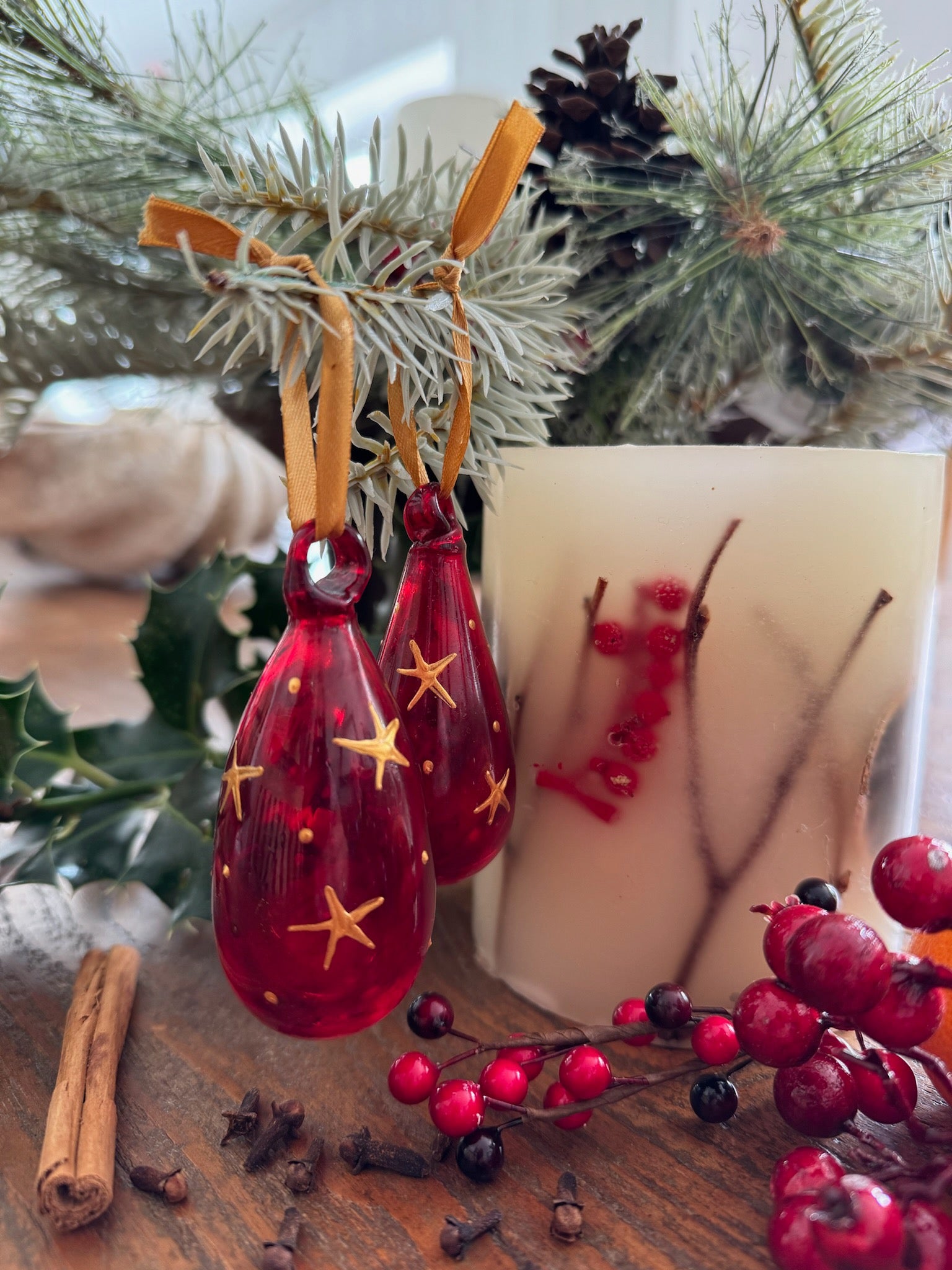 Mini glass Christmas baubles painted with gold stars and hanging on gold ribbon.  handmade in Bethlehem