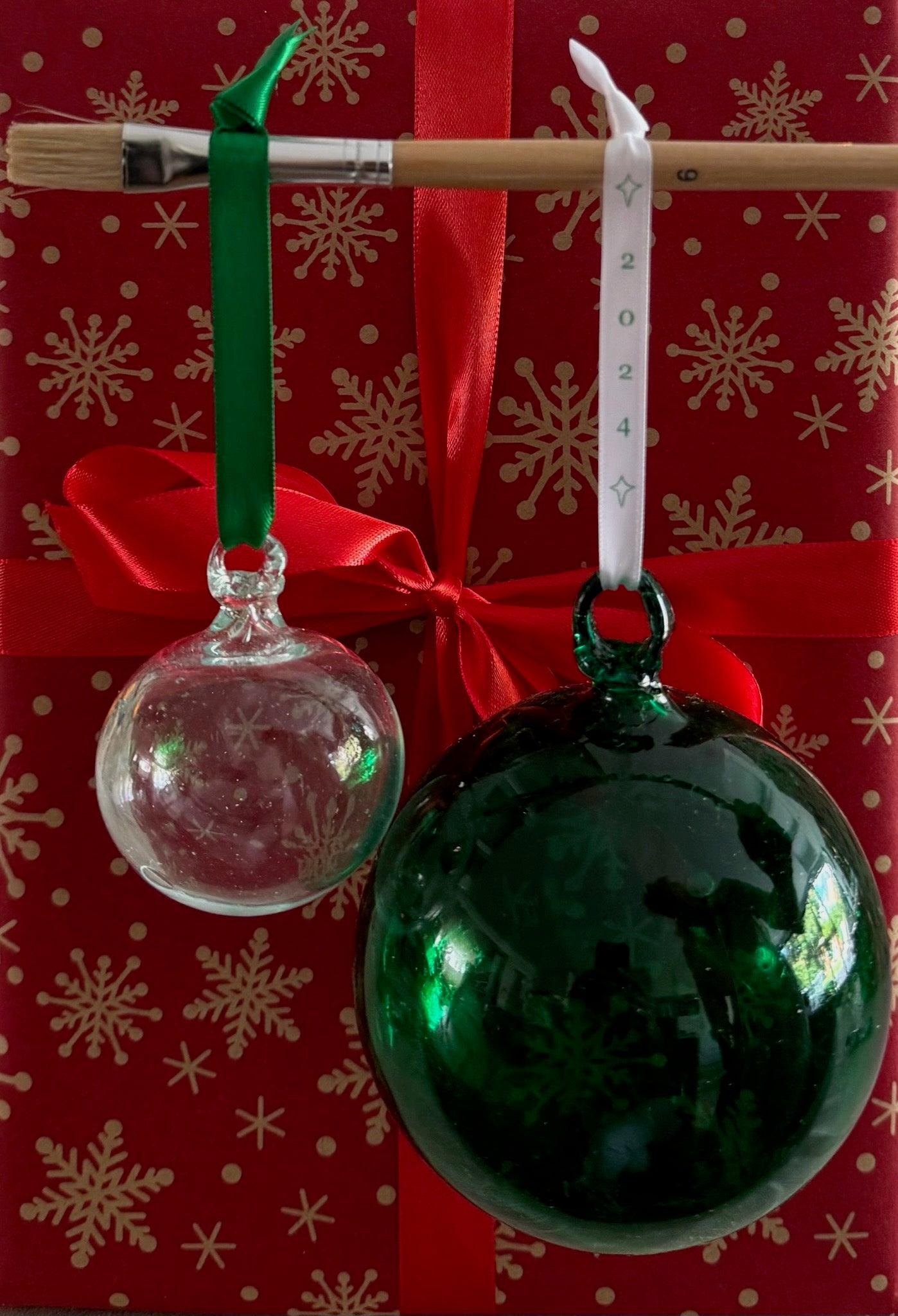 Paint your own hand-blown green glass bauble with a (plain) white ribbon attached for hanging. Made in Bethlehem